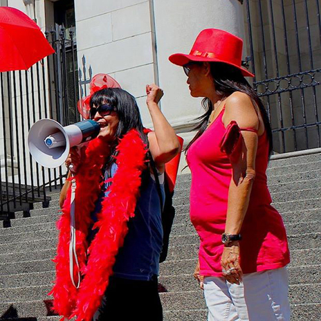 Chili Bean (left) from Sex Workers United Against Violence, gives a rousing speech about solidarity and the importance of standing together. That's SWUAV comrade, DJ on the right. Photo: Esther Shannon